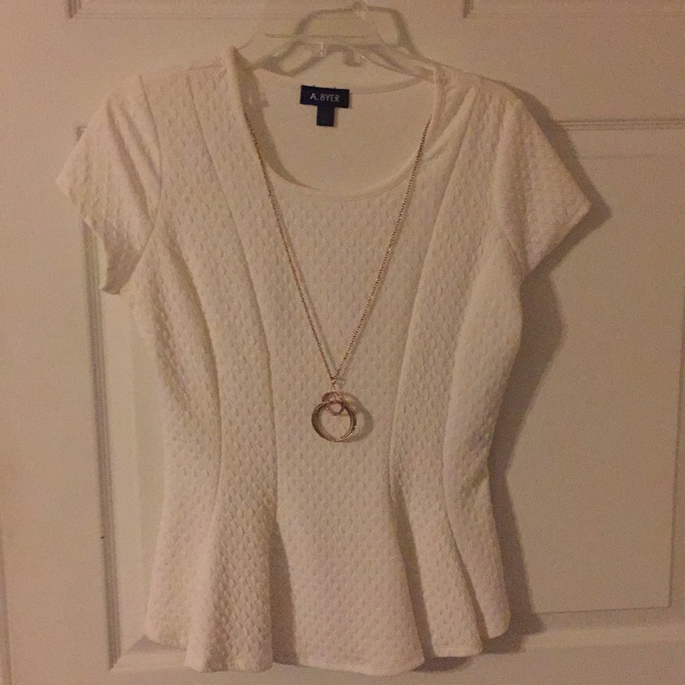 White dress top with attached necklace detail.